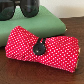 Red oriental Reusable Grocery Bag all rolled up - Andrie Designs