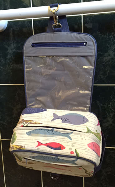 Inside of the fishing-themed Hang About Toiletry Bag - Andrie Designs