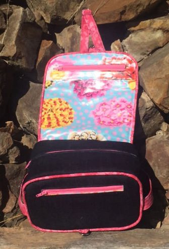 Inside view of the denim and pink Hang About Toiletry Bag - Andrie Designs