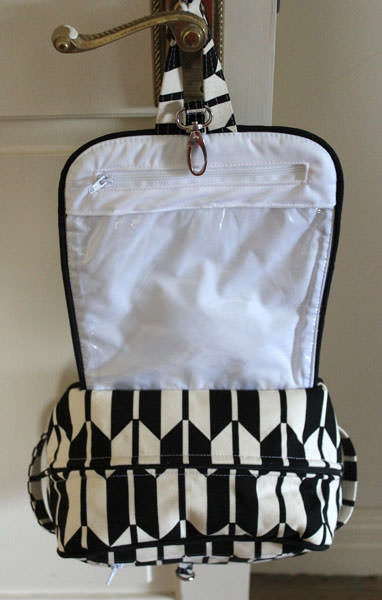 Inside the classic black and white Hang About Toiletry Bag - Andrie Designs