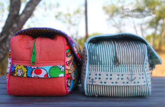 Side view of both sizes of the Hang About Toiletry Bag - Andrie Designs