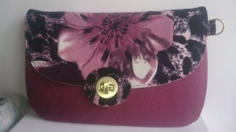 Beautiful magenta flower The Statement Clutch - Andrie Designs