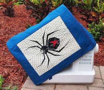 Check out that paper pieced spider! Made For Me Sewing Machine Cover - Andrie Designs