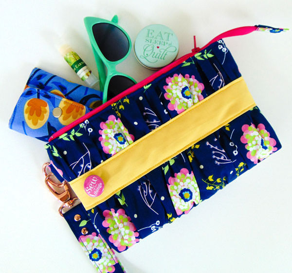 Navy floral with a pop of yellow Gather Me Up Clutch - Andrie Designs