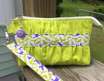 Lime green with a pop of purple Gather Me Up Clutch - Andrie Designs