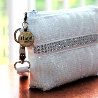 Gorgeous gold on antique brass zipper pull on a stunning Gather Me Up Clutch - Andrie Adornments