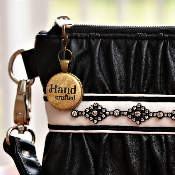 Classic black Gather Me Up Clutch with a gorgeous gold on antique brass zipper pull - Andrie Adornments