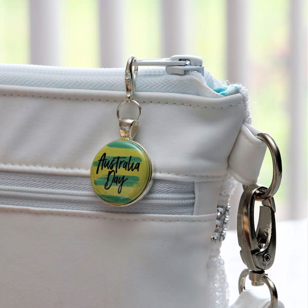 Green and Gold adornment on silver zipper pull - Andrie Adornments