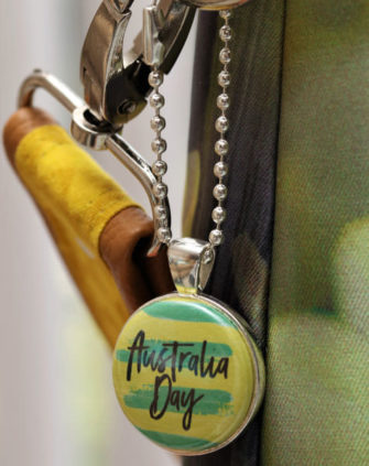 Green and Gold adornment on silver swing tag - Andrie Adornments