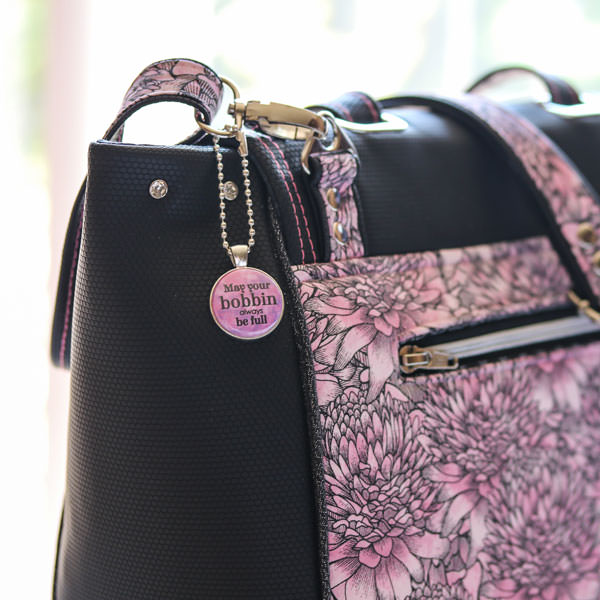 How perfect does this pink swing tag look on this bag! - Andrie Adornments