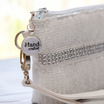 White would make a stunning addition to a bridal clutch! - Andrie Adornments