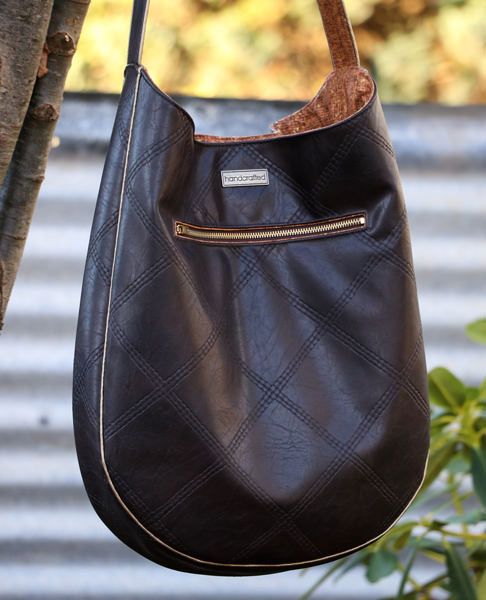 How great is that metal zipper on the back of the leather and gold piping S & S Tote - Andrie Designs