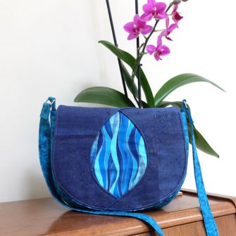 Waves and blue cork make up this Peekaboo Purse - Andrie Designs