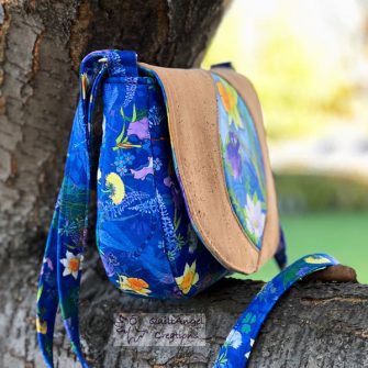 Side view of the beautiful nature-themed print and natural cork Peekaboo Purse - Andrie Designs