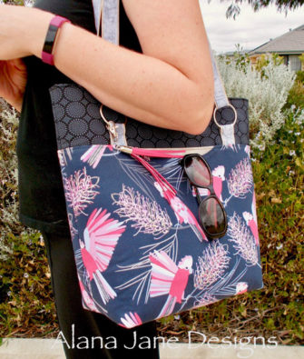 Action shot of the pink lorikeet Classic Market Tote - Andrie Designs