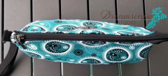 Birds eye view of the teal and black V Pouch - Andrie Designs