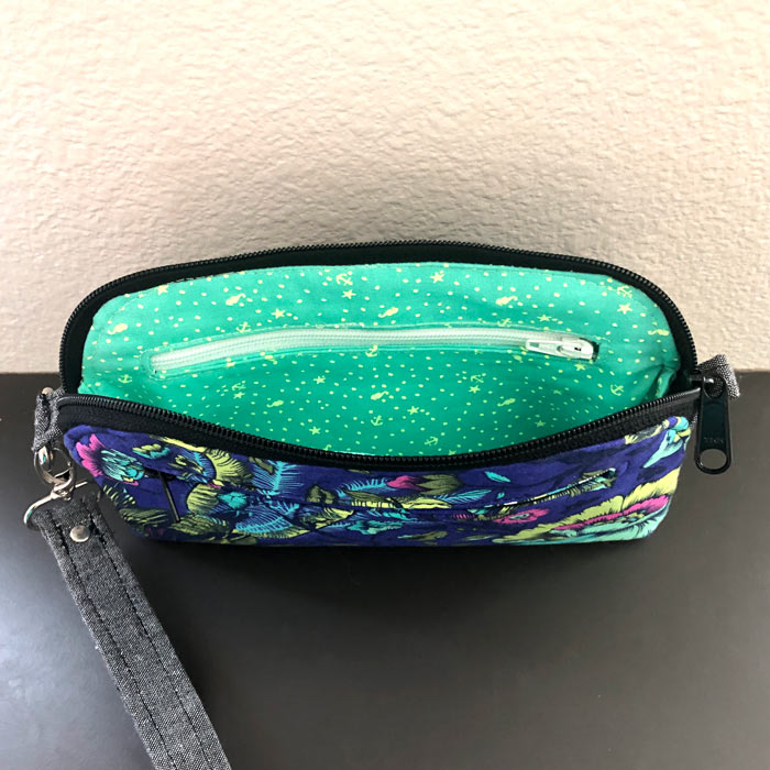 Inside view of the navy floral Gemma Carryall Pouch - Andrie Designs