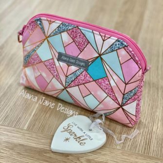 Rear view of the pink and sparkly Gemma Carryall Pouch - Andrie Designs