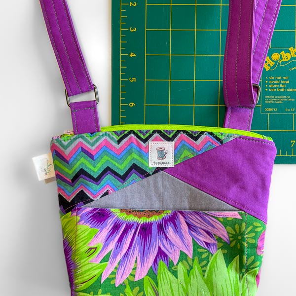 Strap end onto other ring - Stand Up Clutch Crossbody Strap Hack - Andrie Designs