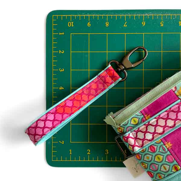 Strap completed using Double Sided Strap Tutorial - Classic Clutch Contrast Hack - Andrie Designs