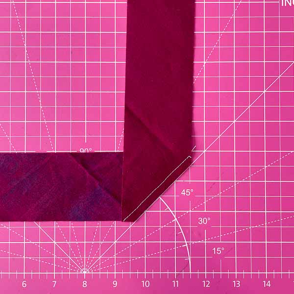 Seam allowance trimmed - Triangle folded in half - How to Cut and Join Bias Strips - Andrie Designs